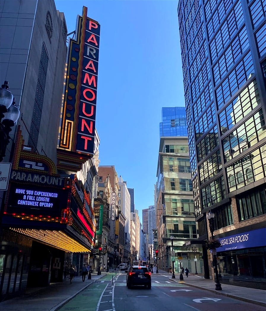 Morning in Boston’s theater district. The Paramount’s neon sign is lit up against skyscrapers and a blue sky, and asks: "Have you experienced a full-length Cantonese opera?"